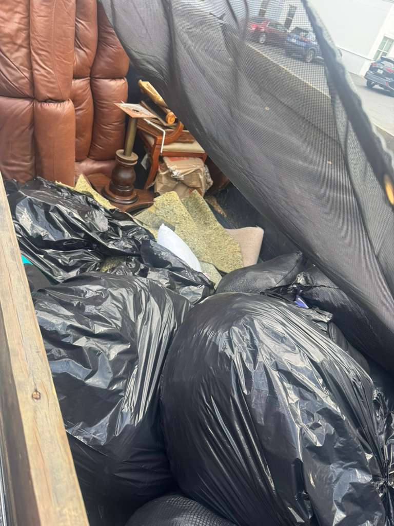 Trailer loaded with bags and junk